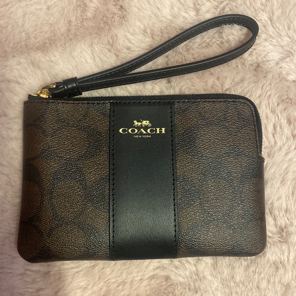 Brand new coach wristlet in black and brown